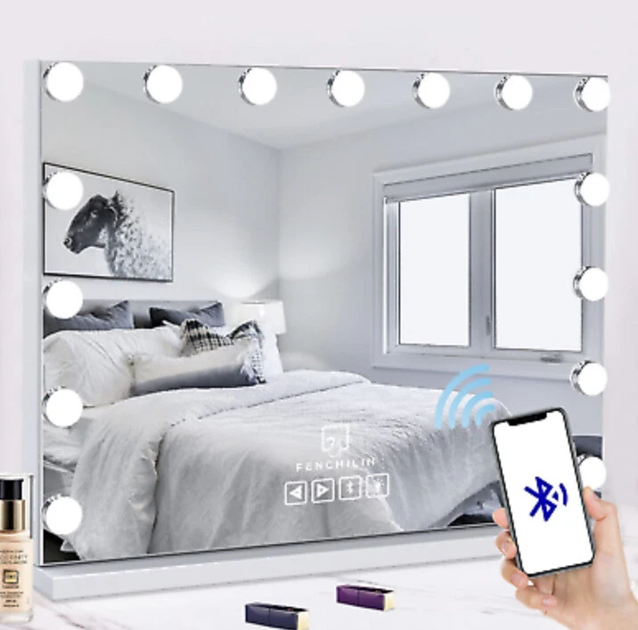Lighted makeup mirror with bluetooth speaker outlet