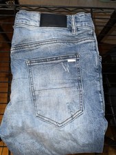 AMIRI Light Blue Distressed Cotton Denim Jean...