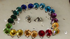 PLATINUM TONE CLIP ON EARRINGS WITH 12MM FACETED RESIN RHINESTONES..UNISEX