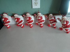Vintage Christmas Blow Mold Skating Santa with bag of toys set of 6