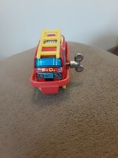 Metal WIND UP FIRE CHIEF Toy red fire truck with yellow ladder And key