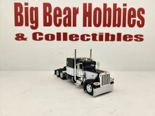 1/64 DCP/FG Black & White 389 Peterbilt 63" Flattop  Sleeper Tractor