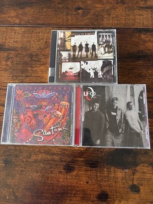 Lot of 3 Music CDs: Santana 'Supernatural', Hootie & The Blowfish 'Cracked Rear