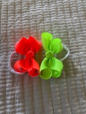 Lot of 2Infant Girl  s 4-inch hairbow on soft band in Neon green and neon orange.