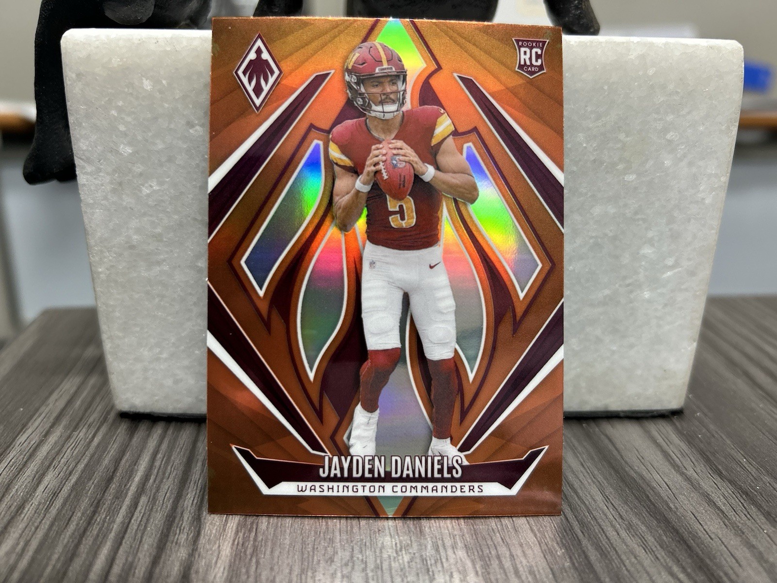 2024 Panini Phoenix - Rookies Jayden Daniels #198 Orange (RC)