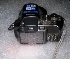 Olympus SP-550 UZ 7.1 MP 28mm Wide Angle 18x Optical Zoom Digital Camera AS-IS