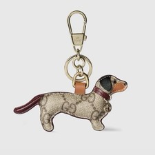 New Boxed Gucci Logo Dog Shaped Bag Charm Beige and Brown Canvas 450 MSRP