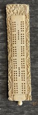 antique asian cribbage board with dragon carving