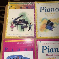 Piano Lesson Books Some Having Writing In Them And Highlight Marks