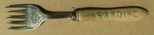 ANTIQUE CARVED BOVINE SARDINE FORK – NOT AN ANTIQUE CARVED WOODEN BUTTER KNIFE