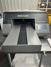 Ricoh RI-1000 DTG printer.