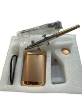 cordless, rechargeable gold airbrush kit with a mini compressor
