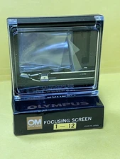 New in Box Vintage Olympus focus screen 1-12 for macro work.  Never used.