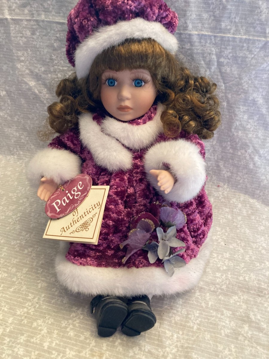 porcelain musical doll. Paige. Purple crushed velvet dress trimmed