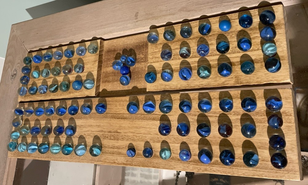 Vintage blue cat's eye and European toy marbles collection  