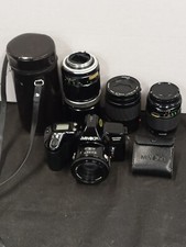 Minolta maxxum 3000i 35mm film camera with 4 lenses, Flash  2 New Batteries