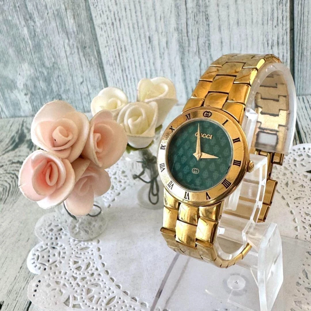 Montre à quartz pour femme vintage Gucci plaquée or cadran noir 3300 L 