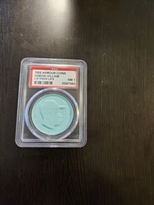 1955 junior gilliam armour coin - AQUA - BATS L - R - GAP - THICK LIPS - PSA 7