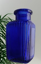Small Triangular Welcome patent cobalt blue glass bottle from 1905 -1920 era
