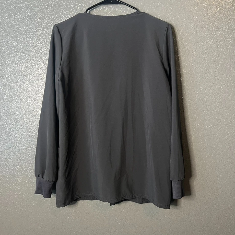 Jaqueta esfoliante Scrub Star tamanho XS cinza escuro com punho frontal de malha detalhes rosa - Imagem 2 de 4