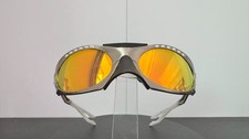 Oakley Plantaris sunglasses with silver frame and red lenses. Gorpcore Y2K styl