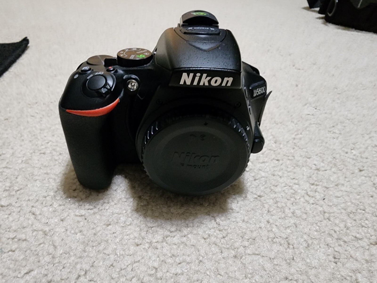 Nikon D5600 with 70300mm, 1855mm, 50mm lens, batteries, remote, and