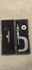 Brown & Sharpe micrometer No. 48 with silver metal shaft, black hard case, and printed brand label on lid.