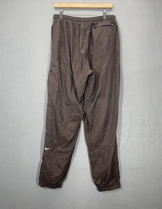 nike track pants brown