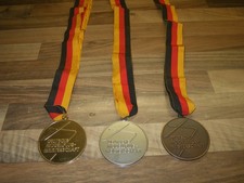 Antik Modellbau Medaille DeAC in Gold , Silber und Bronze
