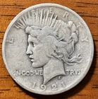 1921 PEACE SILVER DOLLAR. CIRCULATED KEY DATE