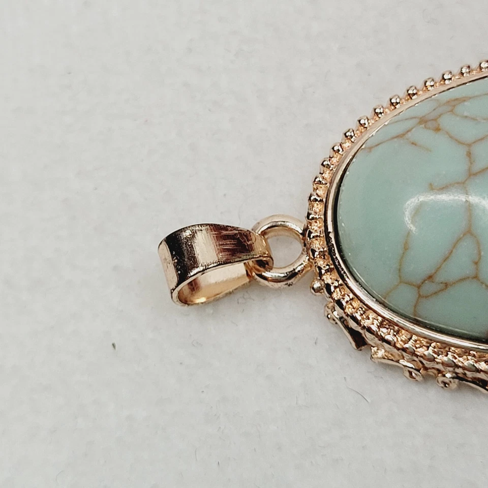 Colgante clásico ovalado de piedra azul claro ovalado tono oro rosa 1928 joyería de moda Foto 4 de 4