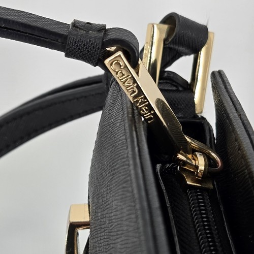 Calvin Klein Black Crossbody Purse with Gold Accents - Stylish & Elegant - Picture 4 of 10