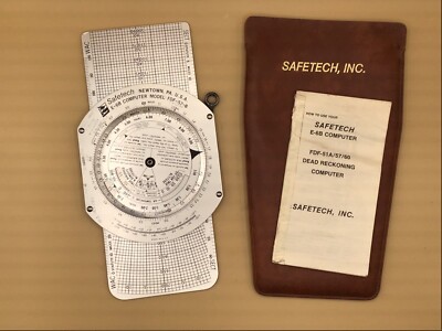 1977 SAFETECH E-6B FLIGHT COMPUTER AND DEAD RECKONING COMPUTER, pouch & manual