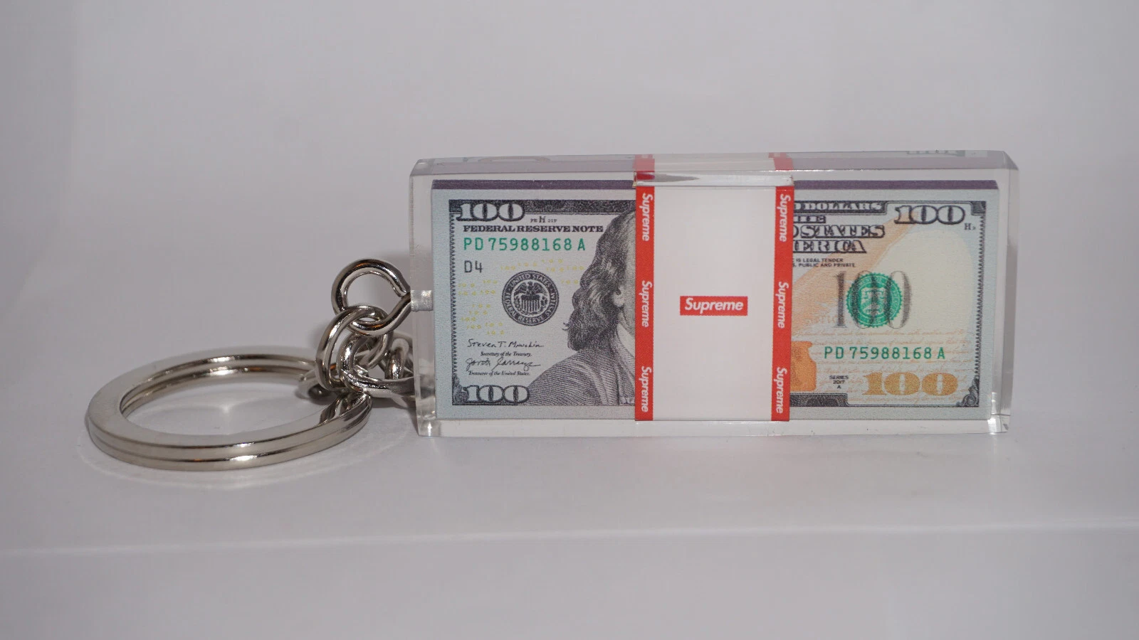 Porte clés presse papier Supreme Cash
