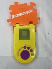 Nickelodeon Nick Puzzler Teal Green Handheld Travel Game Electronic LCD Working