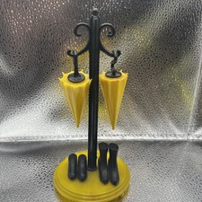 Vintage S P Umbrellas On Stand With Boots.