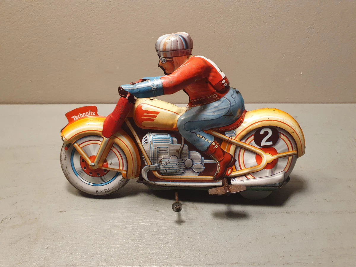 Sold at Auction: A TIN MOTORCYCLE RACER FRICTION TOY (NO. 8) BY TECHNOFIX, MADE