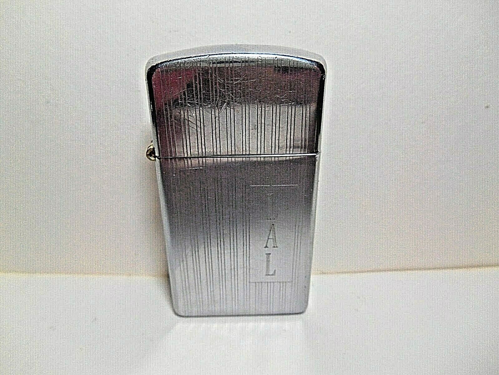 VINTAGE 1963 ZIPPO SLIM PINSTRIPED LINES CIGARETTE LIGHTER