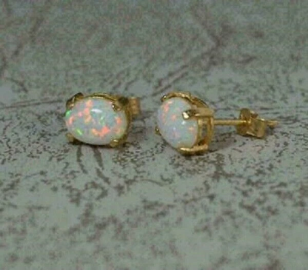 Hermosos aretes solitarios de ópalo de fuego de corte ovalado de 3 quilates con acabado en oro amarillo de 14 quilates Foto 4 de 4