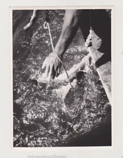 Man's Hand that Grasps the Sea's Bounty Eternal Struggle with Nature's Abstract