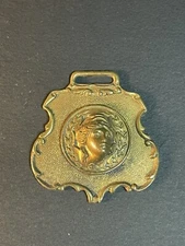Vintage Watch Fob With A Repousse Female Face 
