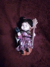 Vtg. HALLOWEEN WITCH SITTING ON PUMPKIN HOLDING BROOM W/ BAT- 5.5 H/ Cute