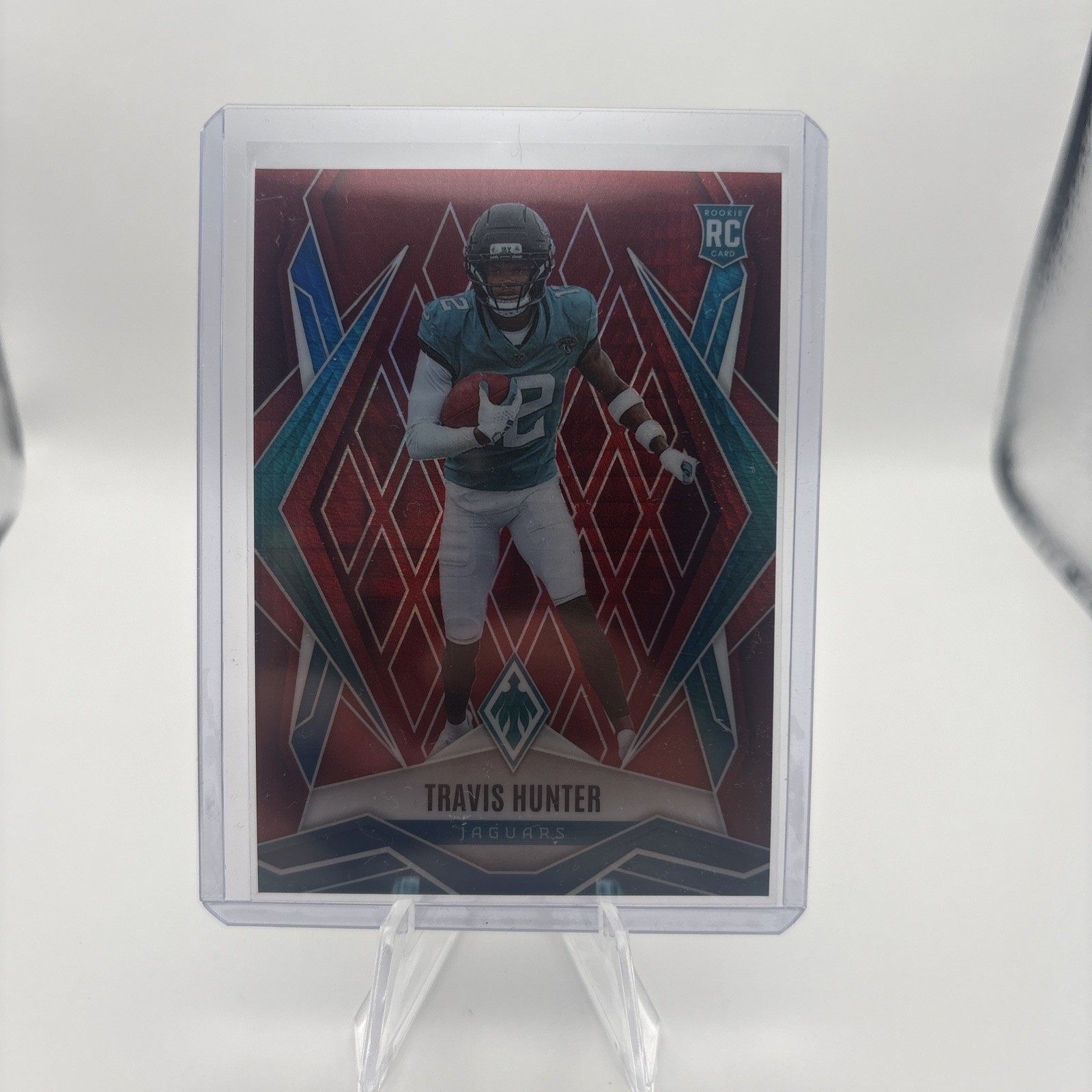 2025 Panini Phoenix - Rookies Travis Hunter #157 Red Hyper /399 (RC) JAGUARS