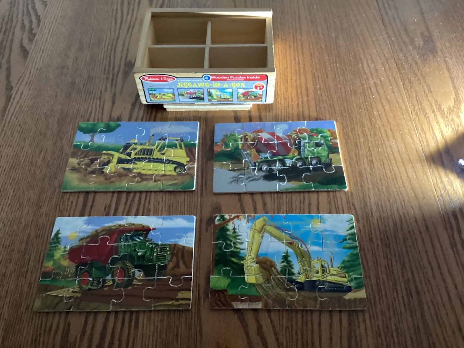 4 Wooden Puzzles in a Box by Melissa and Doug - 4 boxes = 16 puzzles.  Pre owned