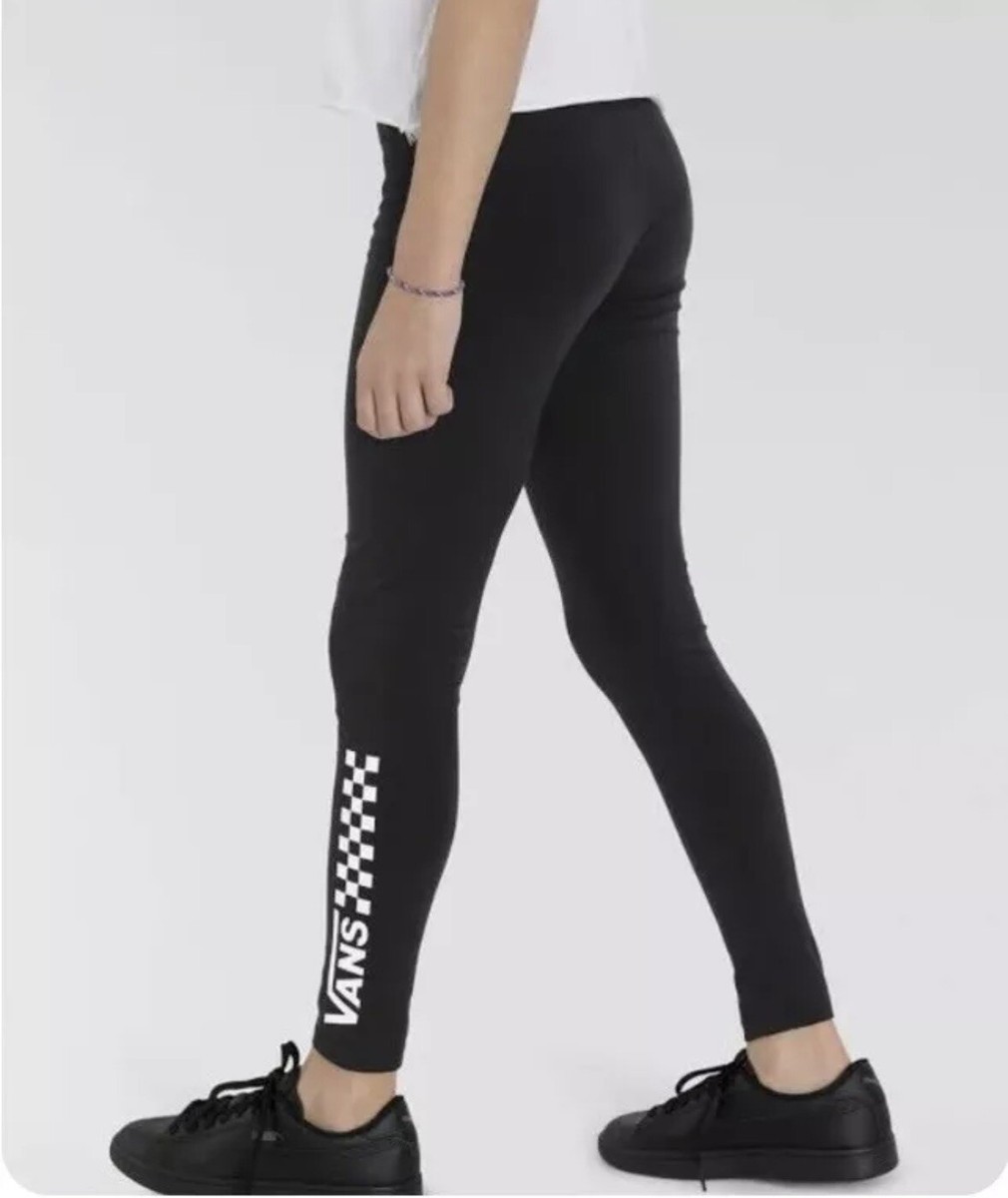 black leggings and black vans sneakers