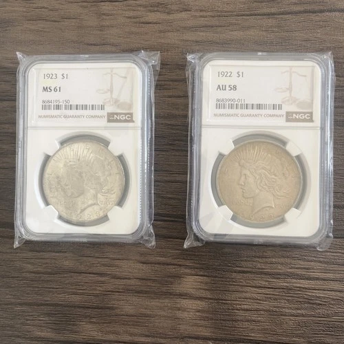 Two Silver Liberty Peace Dollars Graded By NGC MS 61 And AU 58!