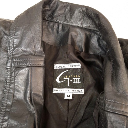 Black leather trench coat with shoulder pads, size M, Global Identity label on inner collar.