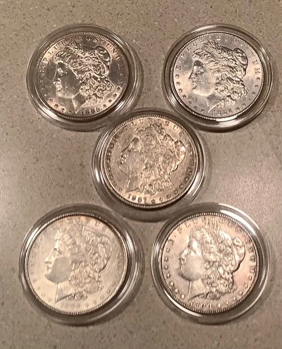 Lot of 5 Morgan silver dollars all are AU. All are different dates.
