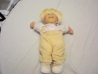 Cabbage Patch doll ‘84 blue eyes with yellow outfit and bonnet