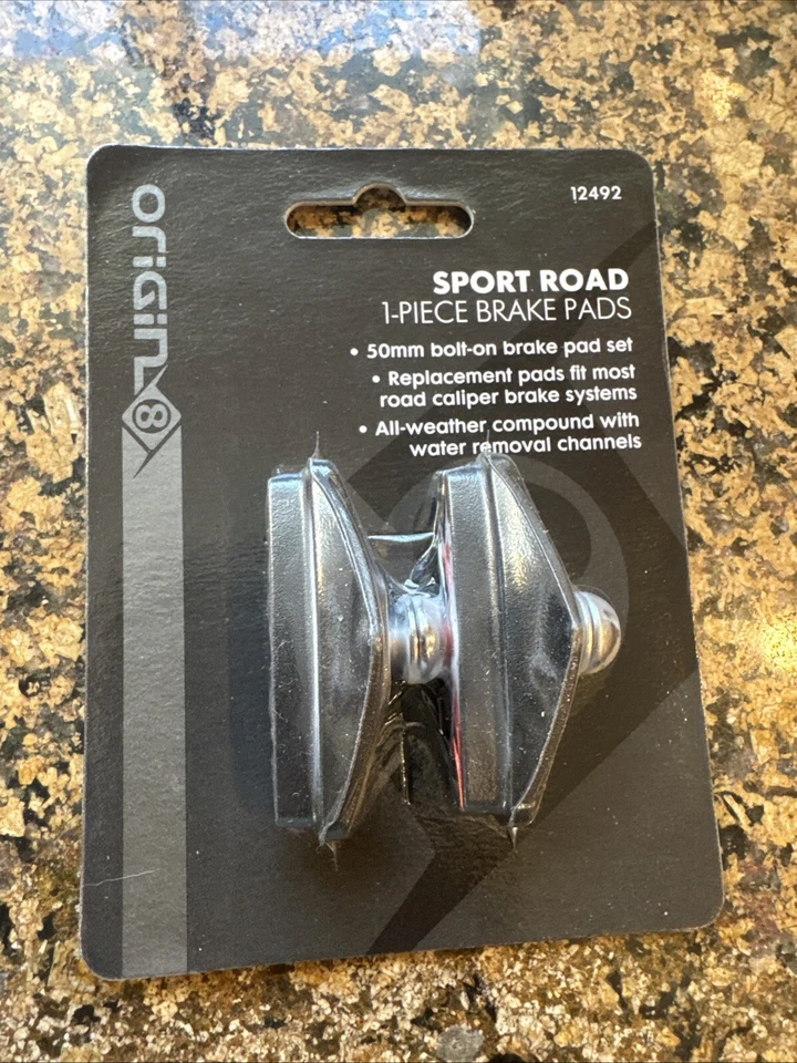 Par de pastillas de freno de carretera deportivas Origin-8 atornillables 50 mm negro/rojo para freno de pinza Foto 2 de 3